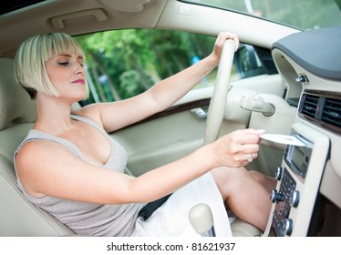 Attractive Woman Changing Cd And Listen Music On Car Radio