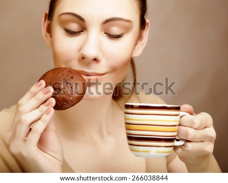attractive woman with coffee and cookies 