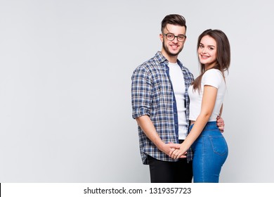 Attractive woman in denim clothes and causasian smiling man in jeans shirt are standing together. Friendly concept. - Shutterstock ID 1319357723