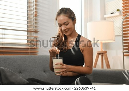 Attractive woman drinking collagen supplements for skin, hair and nail strengthen. Dietary supplement, healthcare concept Foto stock © 