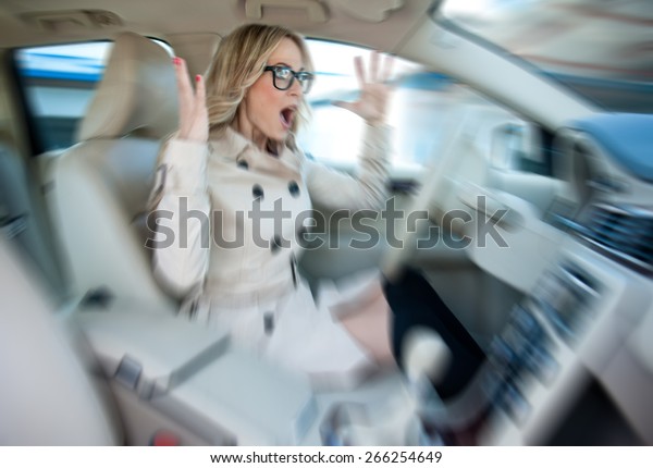attractive woman driver road rage and panic\
expression, zoomed for dramatic effect,\
