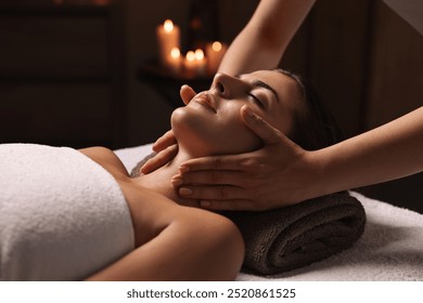 Attractive woman enjoying face massage, closeup. Beauty procedure - Powered by Shutterstock