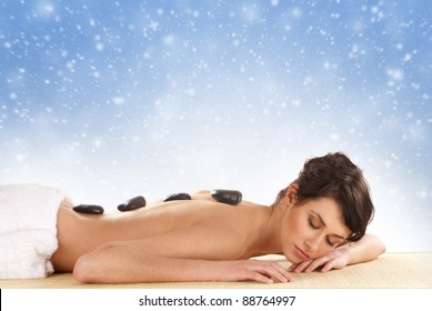 Attractive woman getting spa treatment isolated on white  (Christmas concept)