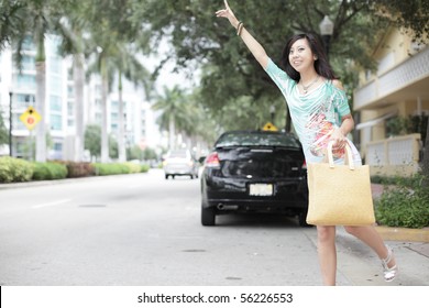 Attractive Woman Hailing A Cab