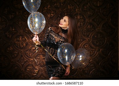 Attractive Woman Holding Baloons And Smiling, Party And Holiday Season Concept