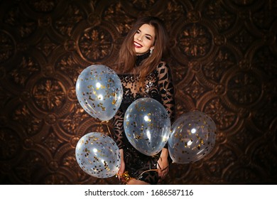 Attractive Woman Holding Baloons And Smiling, Party And Holiday Season Concept