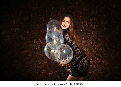 Attractive Woman Holding Baloons And Smiling, Party And Holiday Season Concept