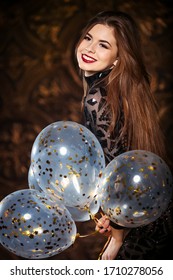 Attractive Woman Holding Baloons And Smiling, Party And Holiday Season Concept