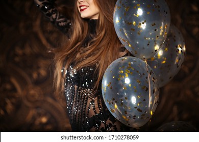 Attractive Woman Holding Baloons And Smiling, Party And Holiday Season Concept