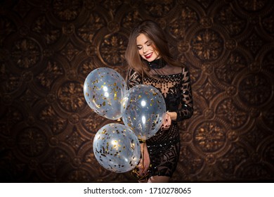 Attractive Woman Holding Baloons And Smiling, Party And Holiday Season Concept