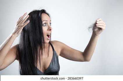 Attractive Woman Is Looking Shocked To Her Lost Hair