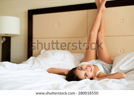 Similar – Image, Stock Photo Young woman lying upside down on an armchair
