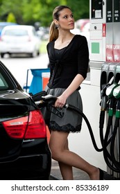 Attractive Woman Refuel Car At Gas Station