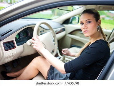 Attractive Woman Sitting In Driver Seat In The Car