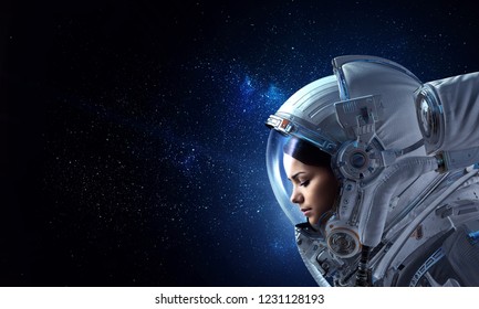 Attractive woman in spacesuit