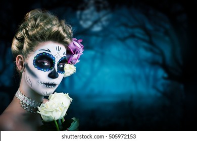 attractive woman with sugar skull make-up