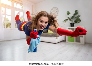 Attractive Woman Superhero Flying Through The Room With A Mop