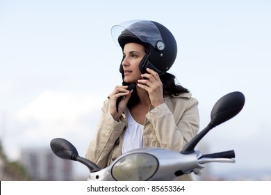 Attractive Woman Takes Off Her Helmet