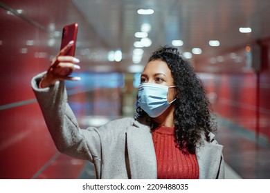 Attractive Woman Taking A Selfie On The Escalator Steps In The Subway .