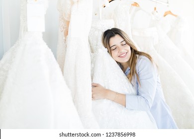 Attractive Woman Taking Sigh Of Relief After Choosing Bridal Dress In Boutique