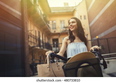 Attractive woman using bicycle as means of transportation - Shutterstock ID 480733810