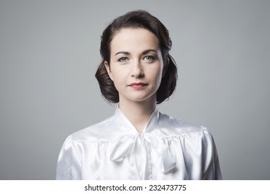 Attractive Woman With Vintage Hairstyle And Elegant Shirt, Looking At Camera