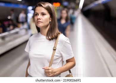 Attractive Woman Waiting For The Subway Train. High Quality Photo