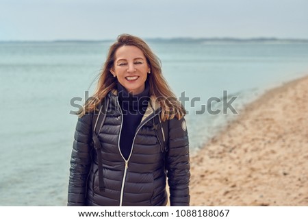 Similar – Pretty healthy woman enjoying a hike on a beach