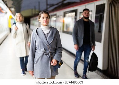 Attractive Woman Walks On The Subway Station. High Quality Photo