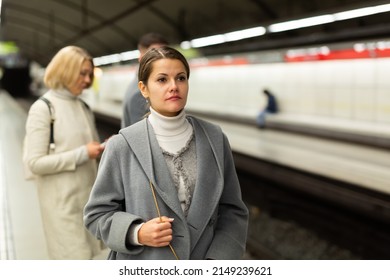 Attractive Woman Walks On The Subway Station