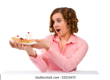 Attractive woman want to eat a cake. Beautiful young female eating the cake. - Shutterstock ID 53315473