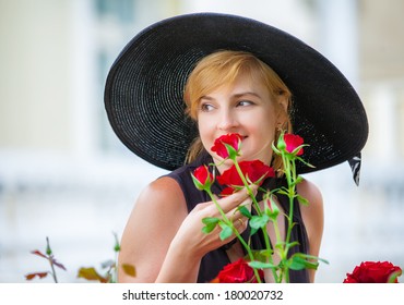 Attractive Woman Wearing Big Black Hat 