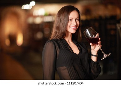 Attractive Woman In The Wine Cellar