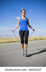 Attractive Women Exercising And Jumping Rope