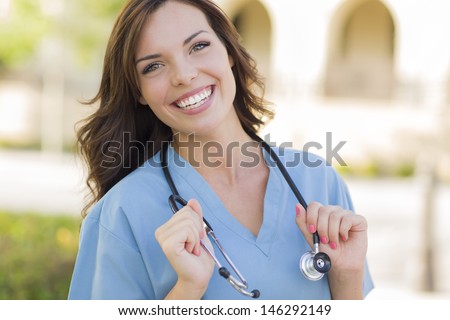 Attractive Young Female Doctor Or Nurse Taking A Male 