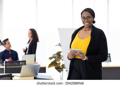 Attractive young african american business woman portrait standing. Business corporate leadership concept