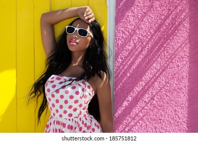 Attractive young african american woman wearing sunglasses