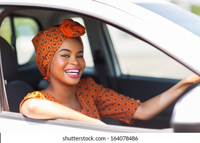 Attractive Young African Woman In A Car