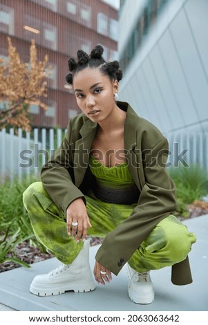 Similar – Woman with green boots walking on spinach field.