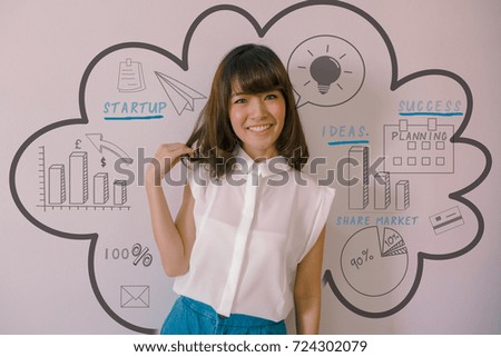 Attractive young Asian business woman with mixed finance business doodles. Entrepreneurship concept
