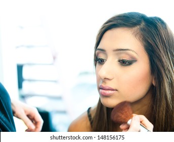 Attractive Young Asian Indian Woman Having Her Make Up Done By A Make Up Artist