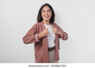 Attractive young Asian woman wearing eyeglasses getting ready to go with neat outfit, isolated by white background. - Powered by Shutterstock