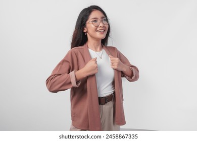 Attractive young Asian woman wearing eyeglasses getting ready to go with neat outfit, isolated by white background. - Powered by Shutterstock