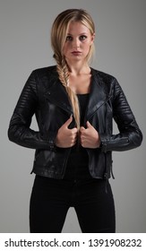 Attractive Young Blonde Caucasian Girl, wearing black leather biker jacket