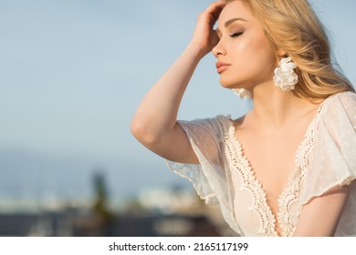 Attractive Young Blonde Long Wavy Hair Woman Enjoying Beautiful City View On Roof Of High Building, Copy Space