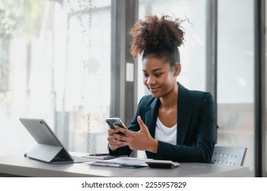 Attractive young business woman african american stock market trader and research solutions for online brokerage, clearing firms, banks, media portals, public companies - Shutterstock ID 2255957829