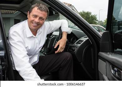 Attractive Young businessman driving car - Shutterstock ID 1006146637