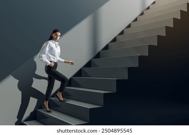 Attractive young businesswoman walking up black stairs and concrete wall. Success, worker, career growth and up concept - Powered by Shutterstock