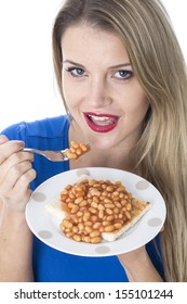 Attractive Young Caucasian Blonde Woman Eating A Meal Of Baked Beans On Toast, Isolated On White, Happy And Confident