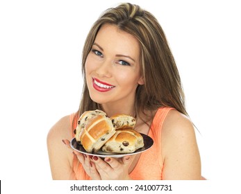 Attractive Young Caucasian Woman, With Brunette Hair, Eating Traditional Easter Celebration Hot Cross Buns, Isolated On White